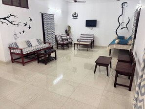 Living area - 2 bedroom apartment with air conditioning. surounded by mango trees.Pet frendly (WC6G+2Q karunapuram, Telangana)