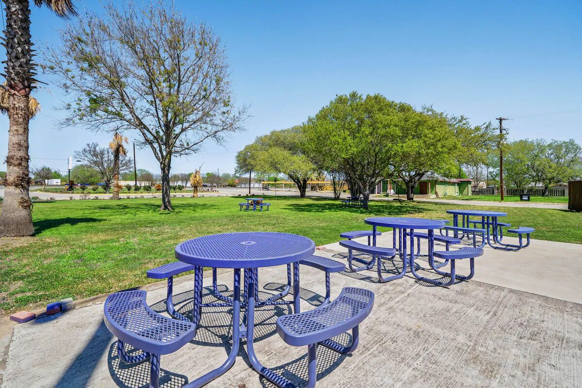 Breathe deep and relax on the open lawn under trees.