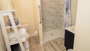 Hair dryer, towels, soap, toilet paper