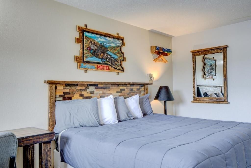 Sink into a plush king bed with rustic charm.