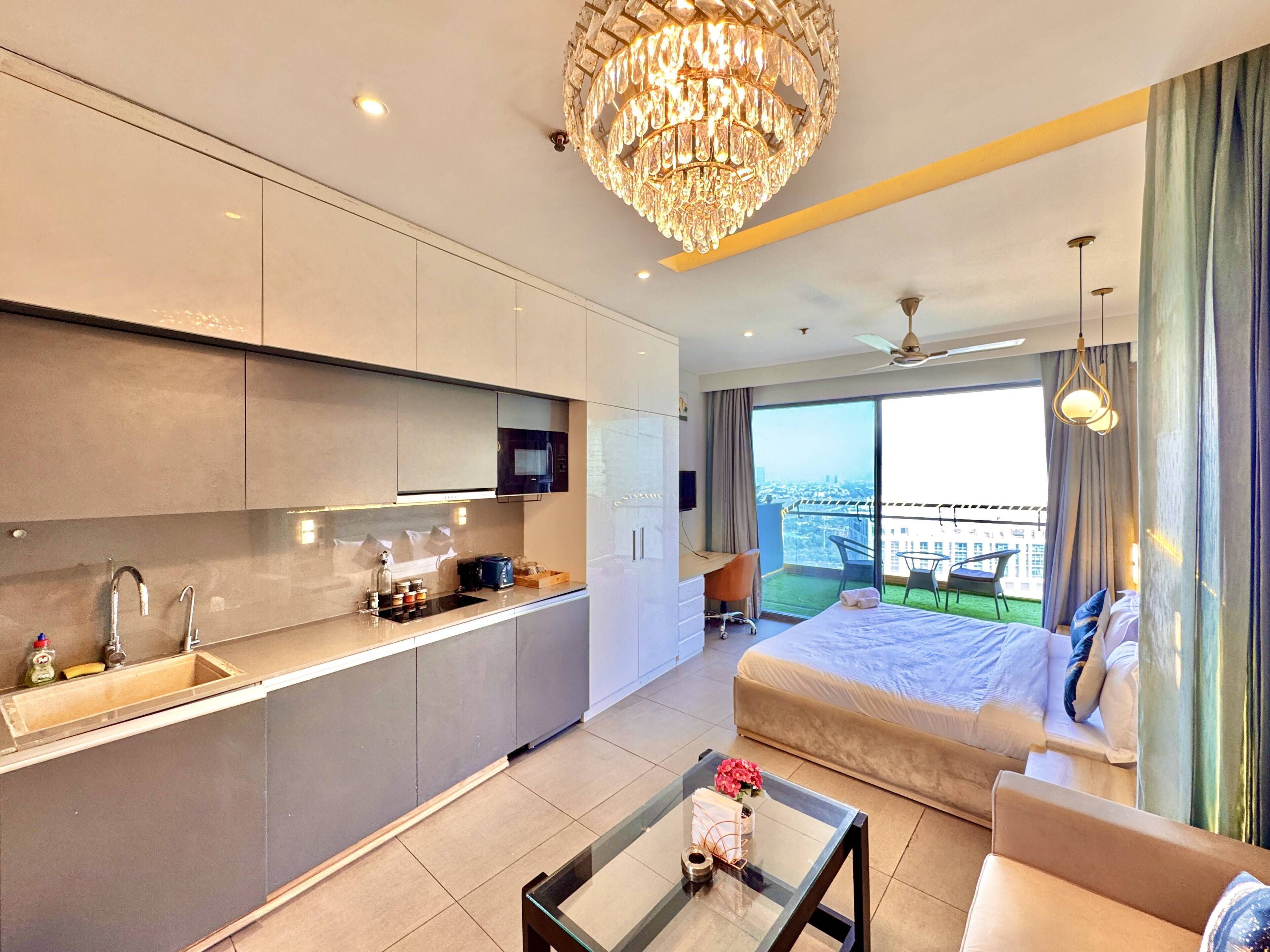 Luxury Studio Suite, Balcony, River View | Individually furnished, desk, laptop workspace, blackout curtains