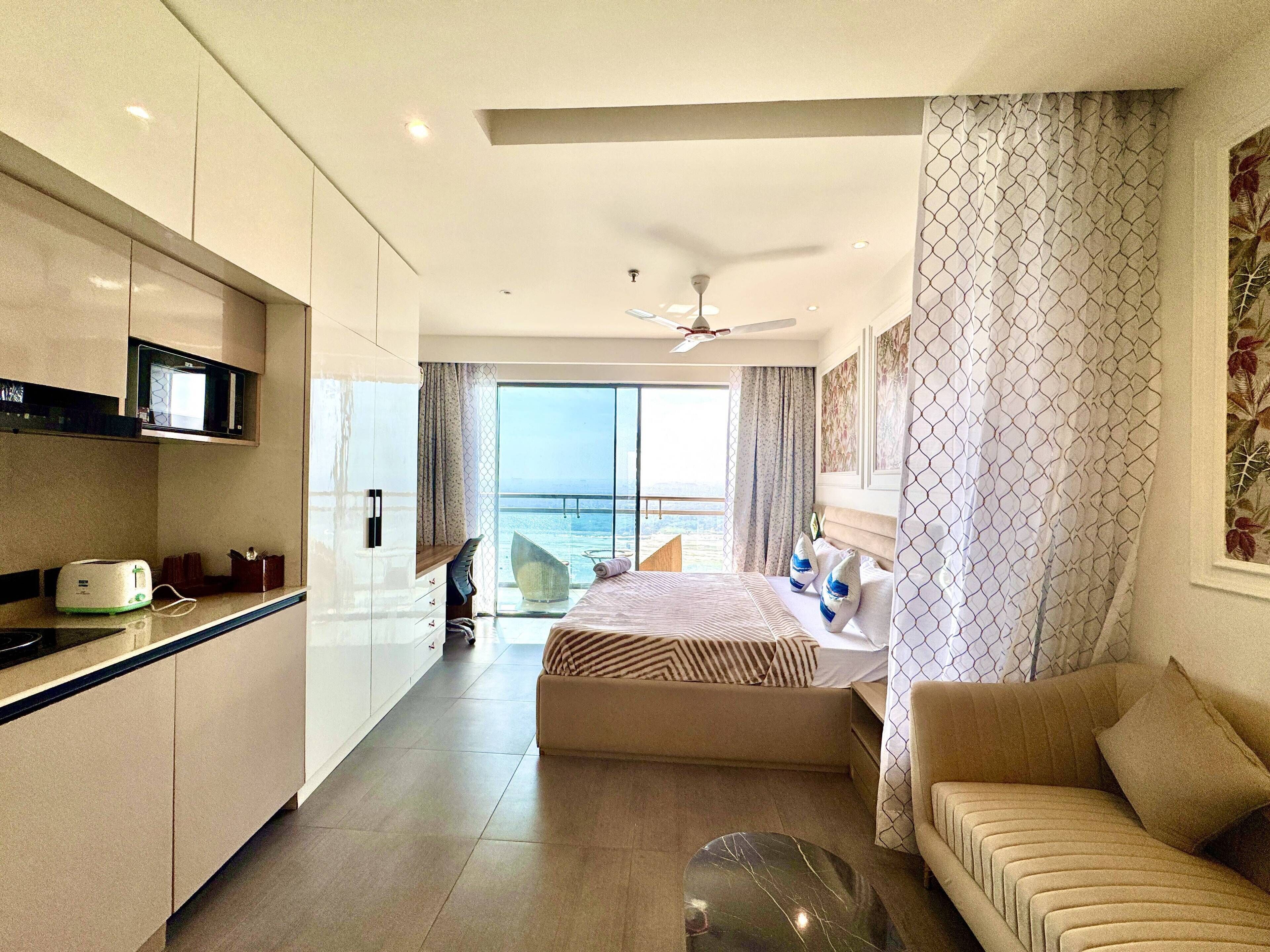 Luxury Studio Suite, 1 Bedroom, Balcony, River View | Individually furnished, desk, laptop workspace, blackout curtains