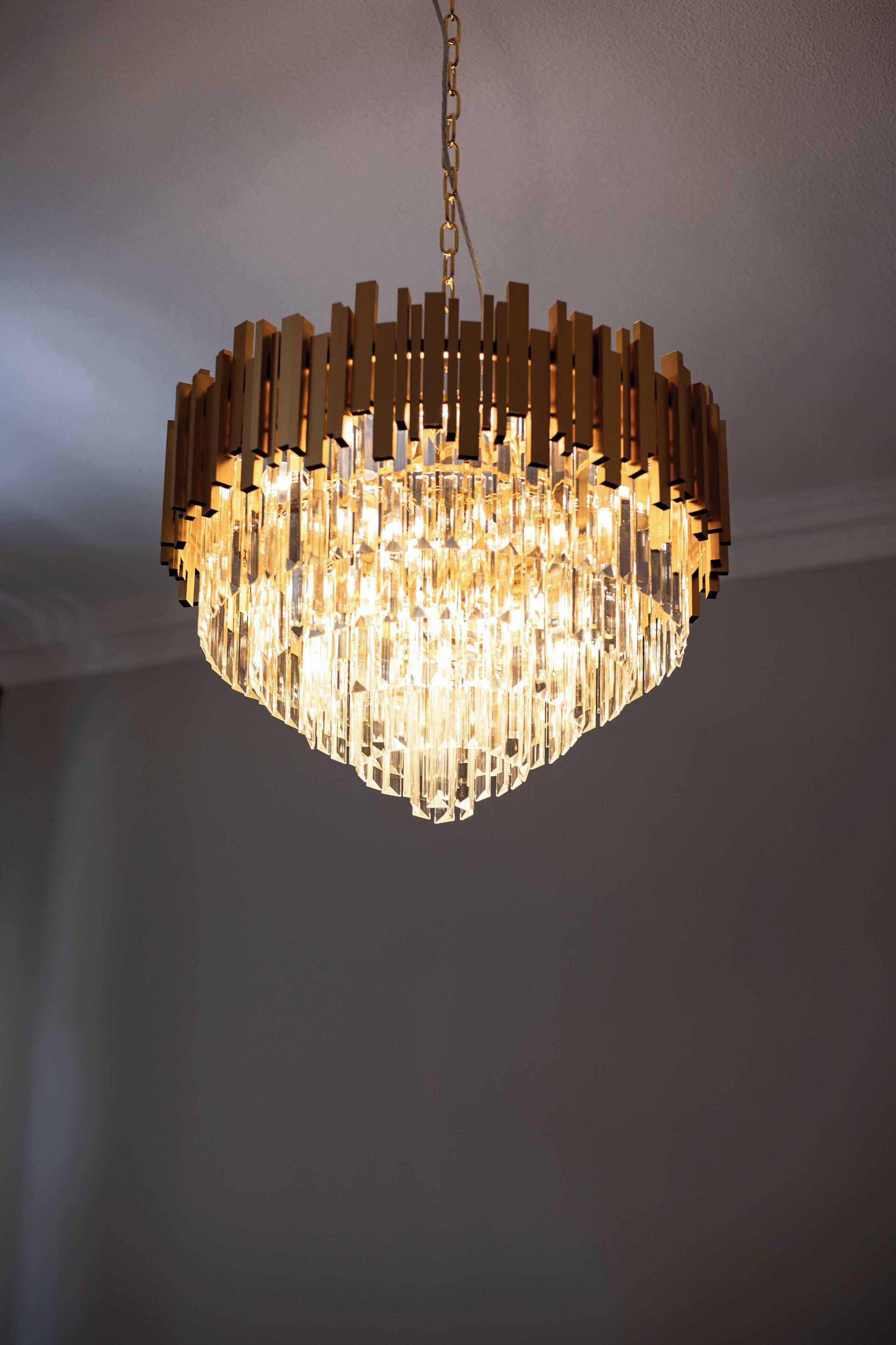 A chandelier with a geometric design and multiple light sources.