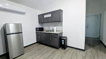 Apartment | Private kitchen | Fridge, microwave, coffee/tea maker, cleaning supplies