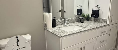 Shower, towels, soap, toilet paper