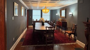 A dining room with a large table, chairs, a chandelier, and a red carpet. - STAFFORD ESTATE IN HISTORIC PHILADELPHIA (Philadelphia)