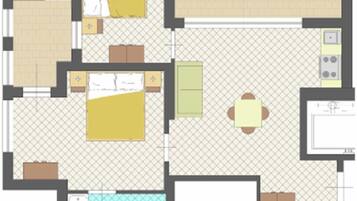 Un plan d’étage d’une chambre d’hôtel comprenant une salle de bain, un coin cuisine, un espace repas et un lit.