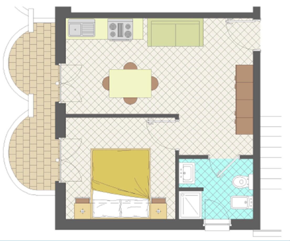 A floor plan of a hotel room with a kitchen, dining area, and a bathroom.