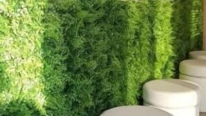 A hallway with a green wall, white circular seating, and recessed lighting. - Anchise Mare Holiday Apartments (Alba Adriatica)