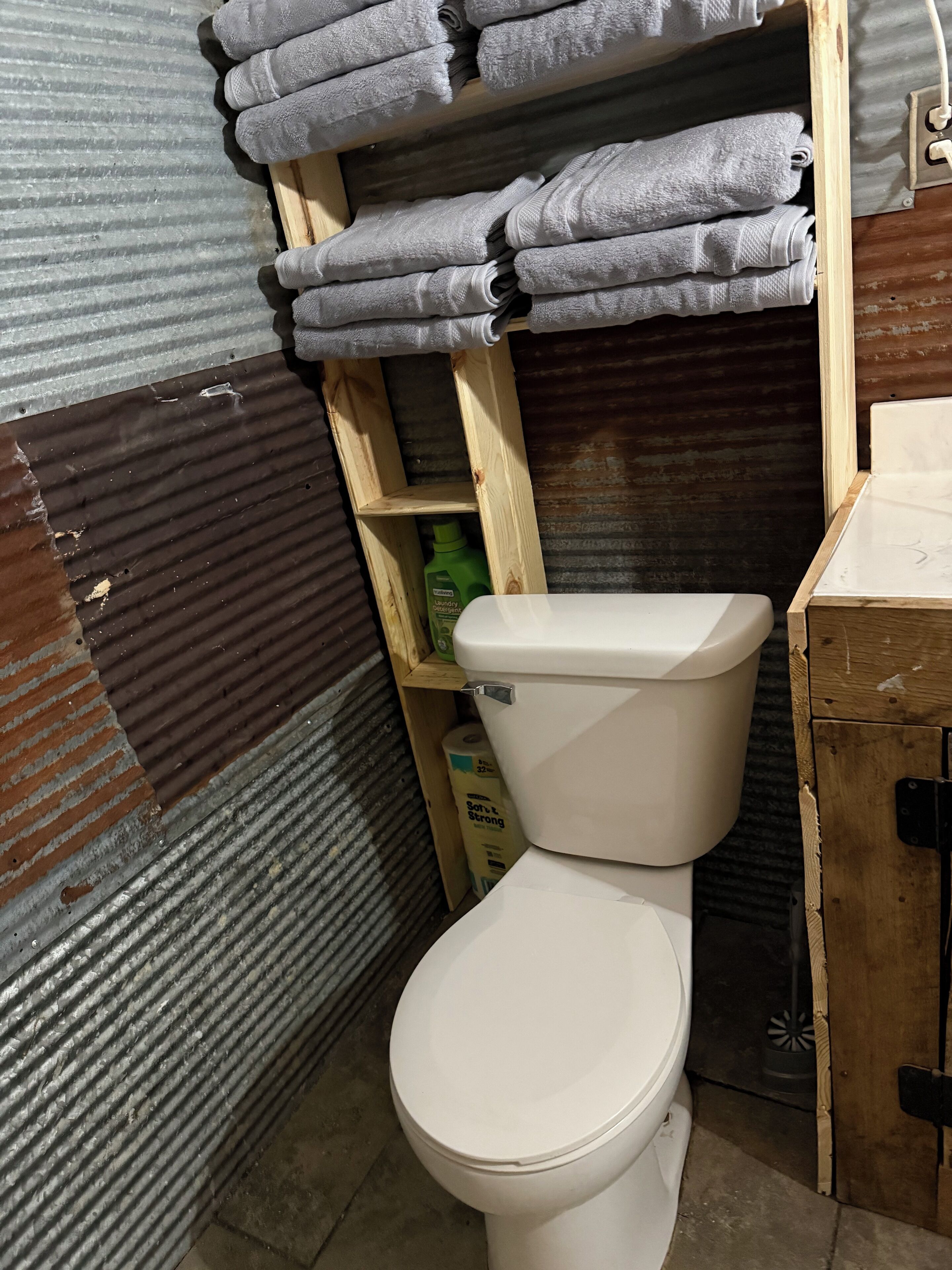 Shower, towels, soap, toilet paper