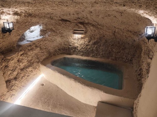 Micaela Cave. Swimming pool in cave and sea views.