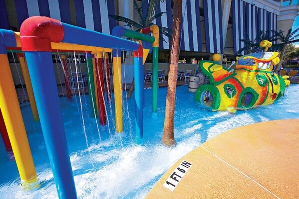 A water play area with colorful structures and a large inflatable vehicle. - 2 Coastal Getaways Close to Dining, Mini Golf, Indoor Pools, and Myrtle Beach (Myrtle Beach)