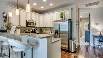 Fridge, microwave, stovetop, coffee/tea maker