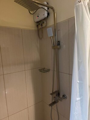 Shower, bidet, towels, toilet paper - Shell Residences MOA 4th C 1BR w/ Balcony pool view (Pasay City)