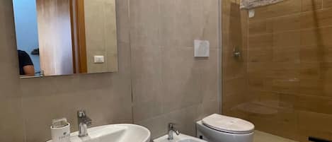 Hair dryer, bidet, towels, soap