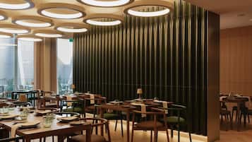 Settle into an elegant dining room with warm, modern ambience.