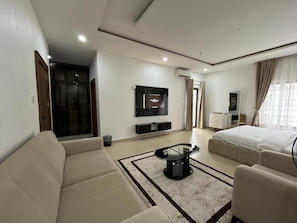 Deluxe Room, Balcony, City View | Desk, laptop workspace, blackout curtains, soundproofing