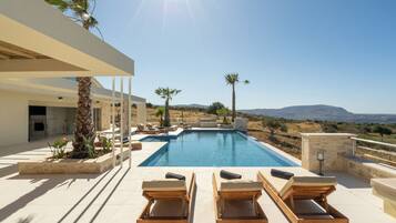 Outdoor pool, pool umbrellas, sun loungers