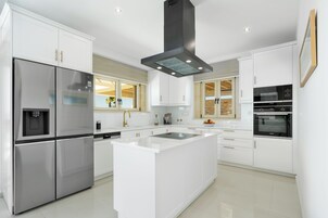 Luxury Villa | Private kitchen | Full-size fridge, microwave, oven, stovetop