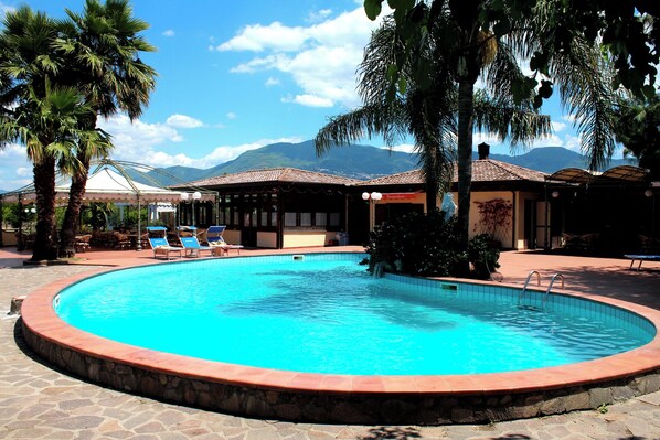 Seasonal outdoor pool, pool loungers