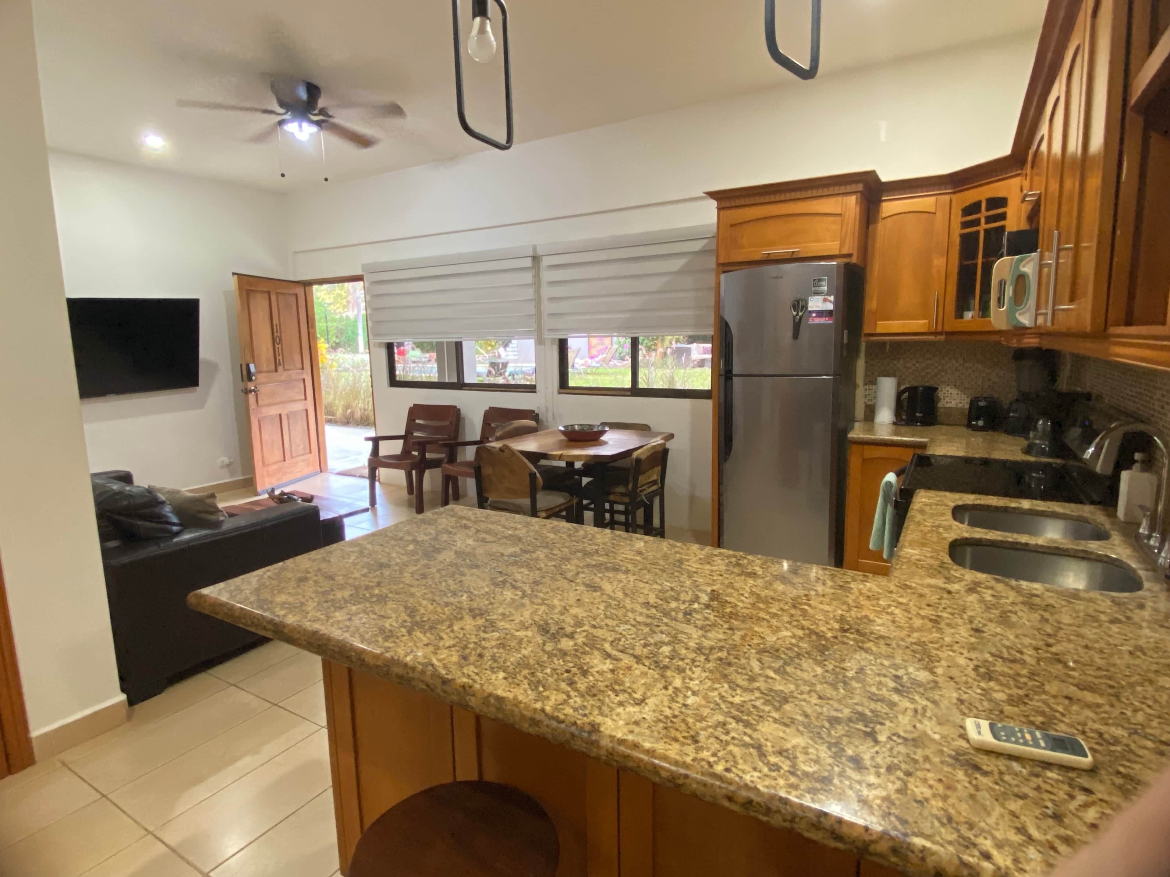 Coffee/tea maker, fridge, microwave, oven