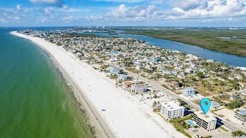 On the beach, white sand, beach shuttle, beach towels