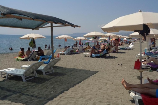 Private beach, white sand, sun loungers, beach umbrellas