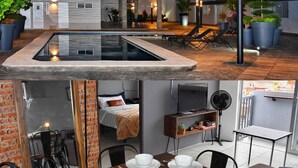Ein modernes Hotel mit Pool auf dem Dach, Außenbereich zum Sitzen und einem Essbereich.