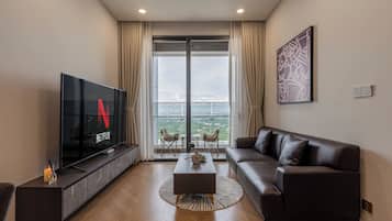 Luxury Apartment, 1 Bedroom, Balcony, City View | Living area | 55-cm Smart TV with digital channels