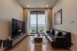 Luxury Apartment, 1 Bedroom, Balcony, City View | Living area | 55-cm Smart TV with digital channels - LaLa West Tower Lumiere Riverside (Ho Chi Minh)
