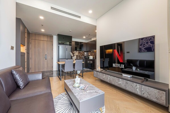 Luxury Apartment, 1 Bedroom, Balcony, City View | Living area | 55-cm Smart TV with digital channels - LaLa West Tower Lumiere Riverside (Ho Chi Minh)