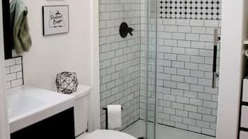Shower, eco-friendly toiletries, hair dryer, towels