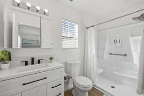 Shower, hair dryer, towels