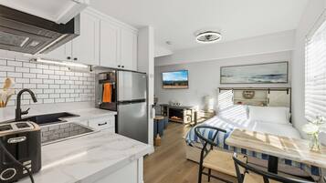 1 bedroom, desk, iron/ironing board, travel crib