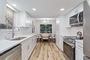 Fridge, microwave, oven, stovetop - Rhythm Retreat: Stunning 5-bedroom in Austin with Large Pool, Game Room, Firepit (Austin)