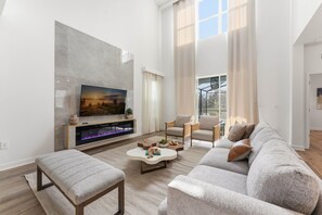 House (5 Bedrooms) | Living area | 50-inch Smart TV with cable channels - Stylish Family Villa, Themed Rooms, Pool (Kissimmee)