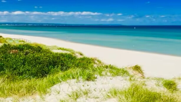 A beach with white sand and clear turquoise water. - Waterfront Marina Escape (Patterson Lakes)