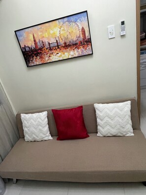 Living area - Cozy 1-bedroom condo in serene Pasay City with AC (Pasay City)