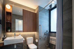 Standard Suite, City View | Bathroom | Shower, free toiletries, hair dryer, slippers