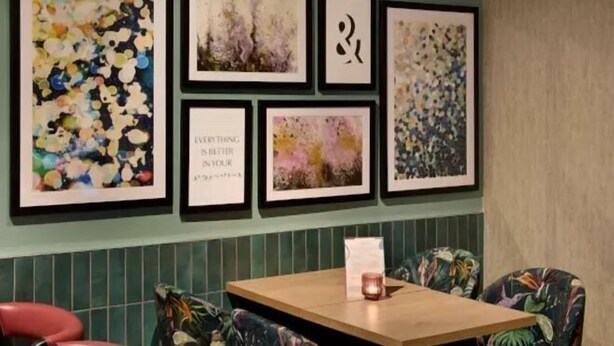 A dining area with a wooden table and floral-patterned chairs. - Welwyn Garden City (Welwyn Garden City)