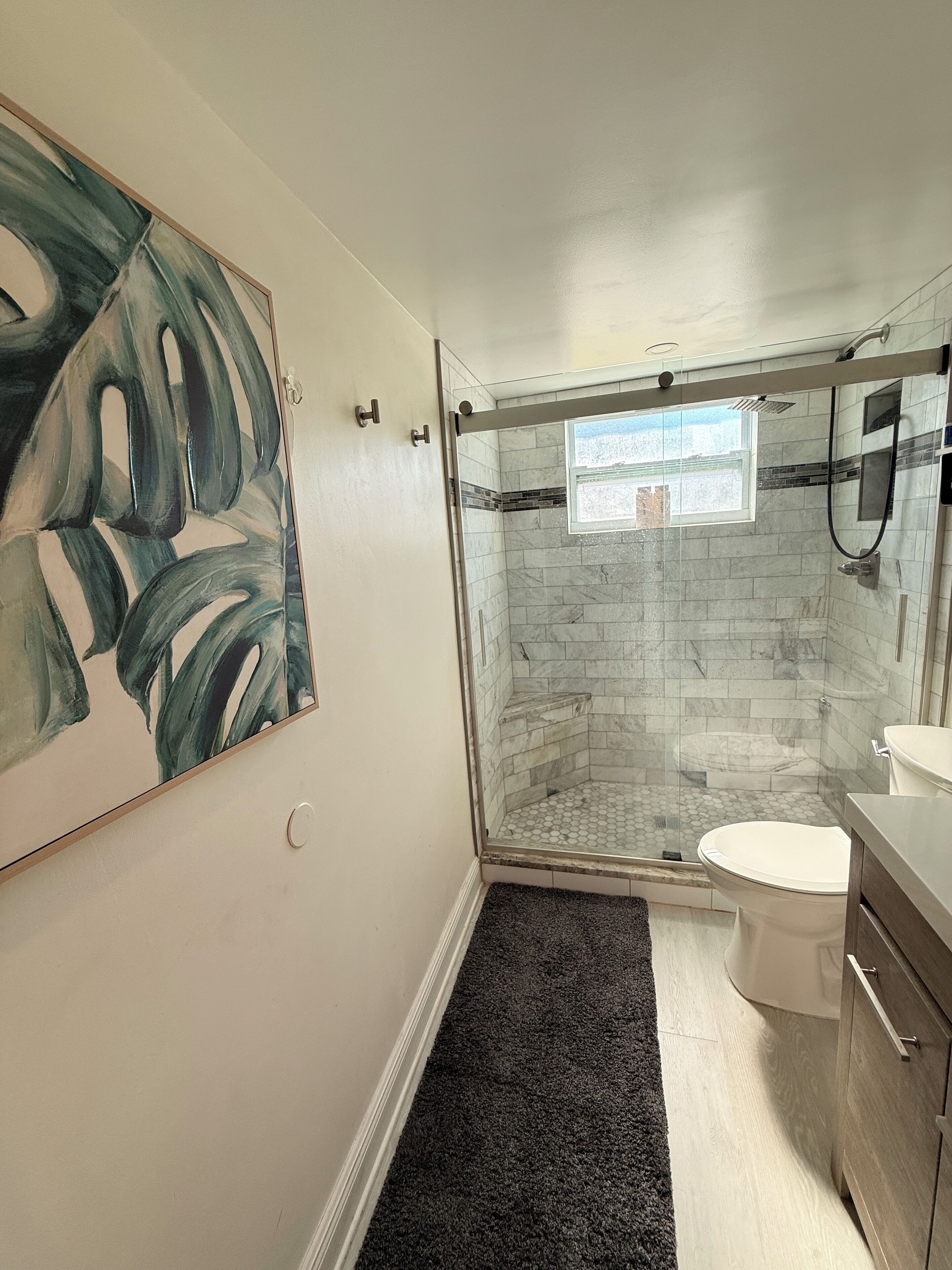 Shower, towels, soap, toilet paper