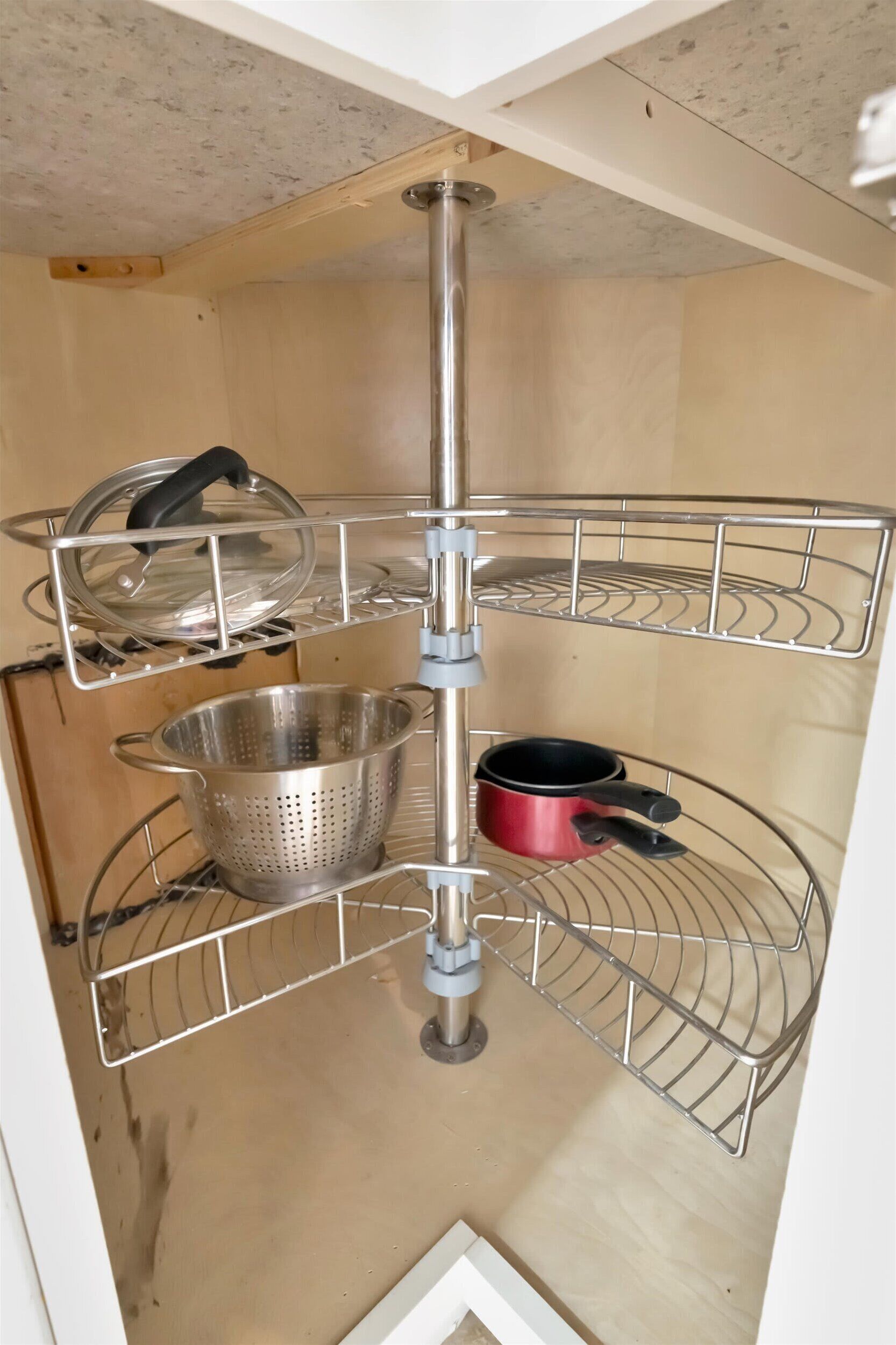 A corner shelf unit with multiple levels for storage.