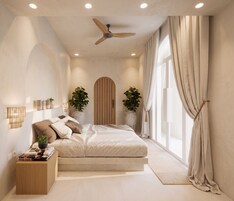 A bedroom with a bed, bedside tables, a ceiling fan, and large windows with curtains.