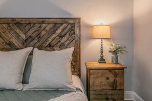 1 bedroom, desk, iron/ironing board, travel crib