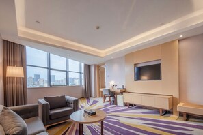 Suíte club, vista para a cidade | Área de estar