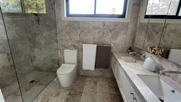 Shower, hair dryer, towels, soap