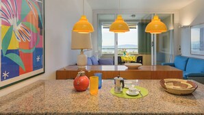 A modern kitchen with granite countertops, a coffee maker, and a red gas canister. - Boboli2 by Interhome (Punta Ala)