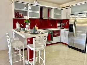 Fridge, microwave, coffee/tea maker, paper towels