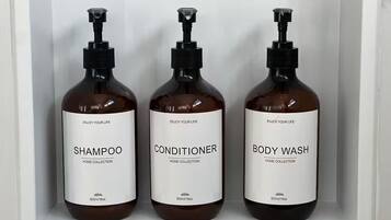 Shower, towels, soap, toilet paper