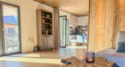 Luxueux chalet alpin au bord d'un lac avec sauna